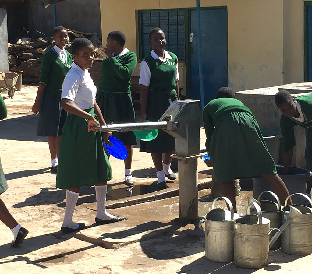 Fetching water at St. Monica's