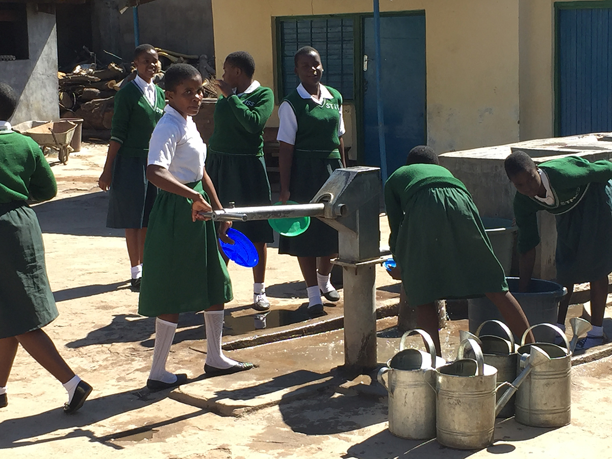 Fetching water at St. Monica's